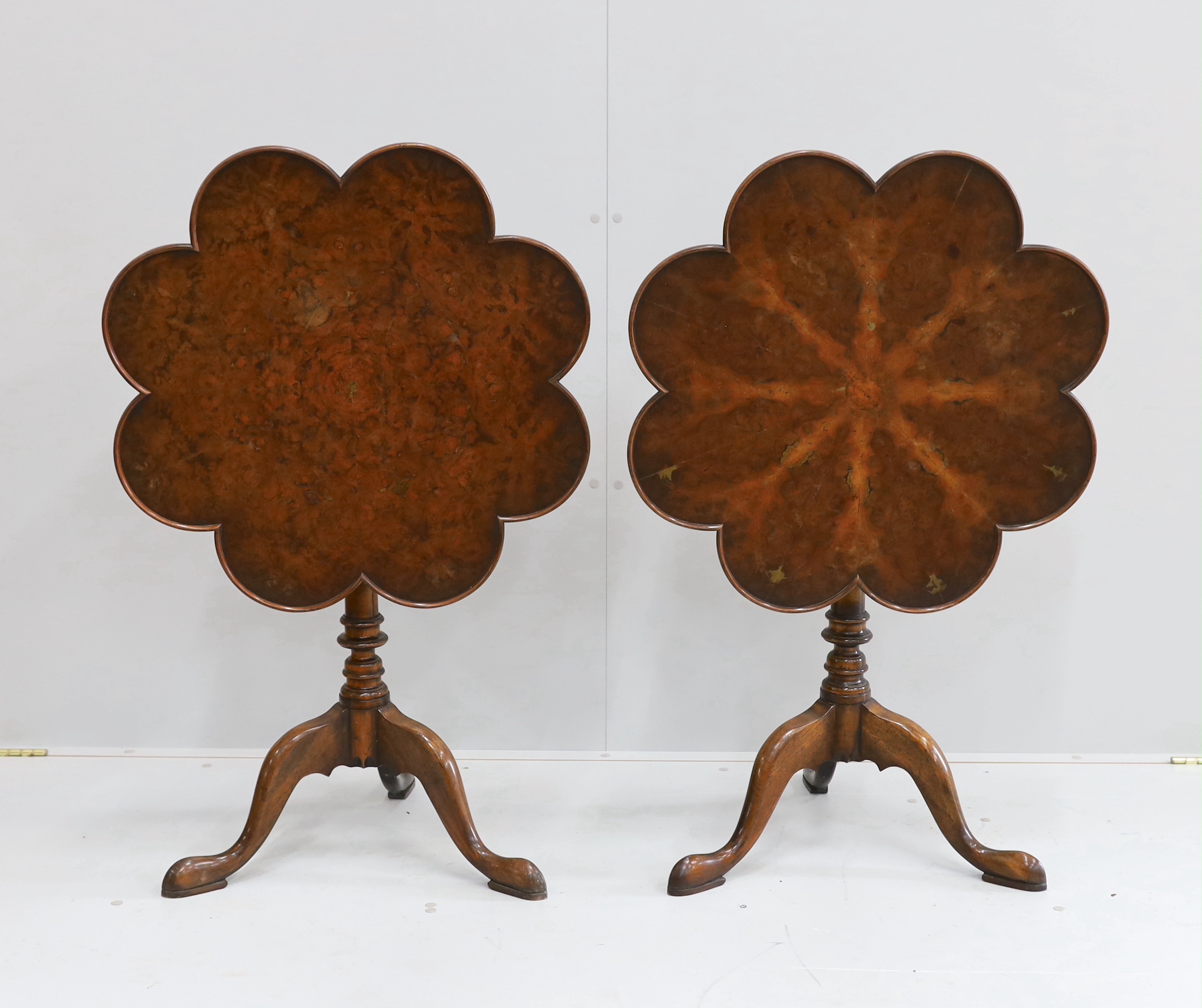 A pair of reproduction George III style mahogany and bird's eye maple tilt top tripod tea tables, width 68cm, height 69cm